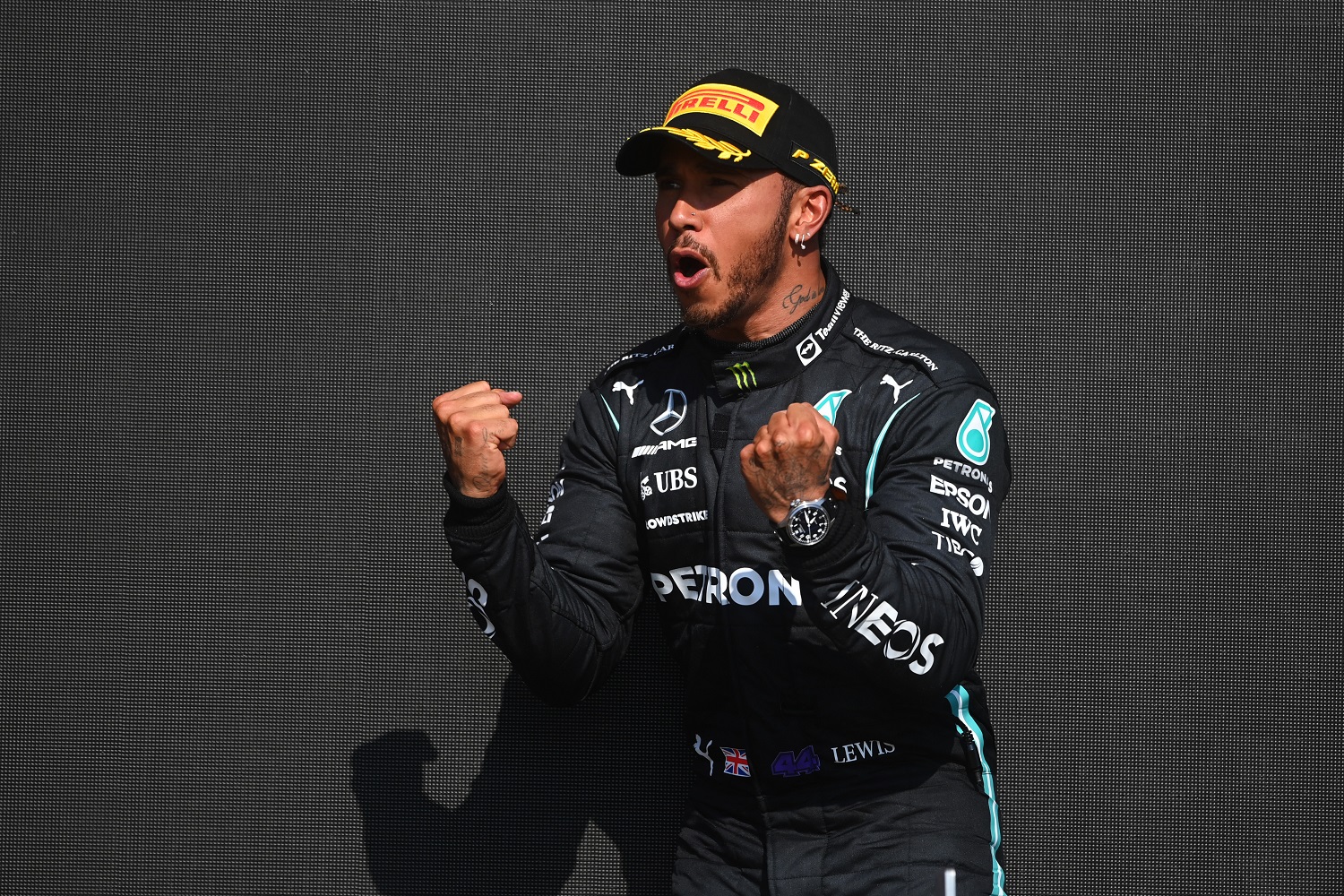 Race winner Lewis Hamilton celebrates on the podium during the Formula 1 Grand Prix of Great Britain at Silverstone on July 18, 2021 in Northampton, England.