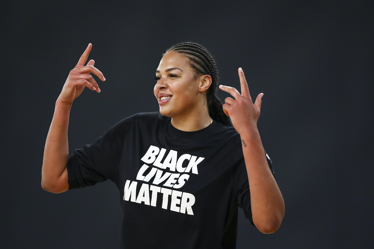Center Liz Cambage of the Las Vegas Aces, who recently withdrew from the Australian National Team for the Tokyo Olympics, reacts during warm ups before the game against the Los Angeles Sparks at Los Angeles Convention Center on July 02, 2021 in Los Angeles, California.