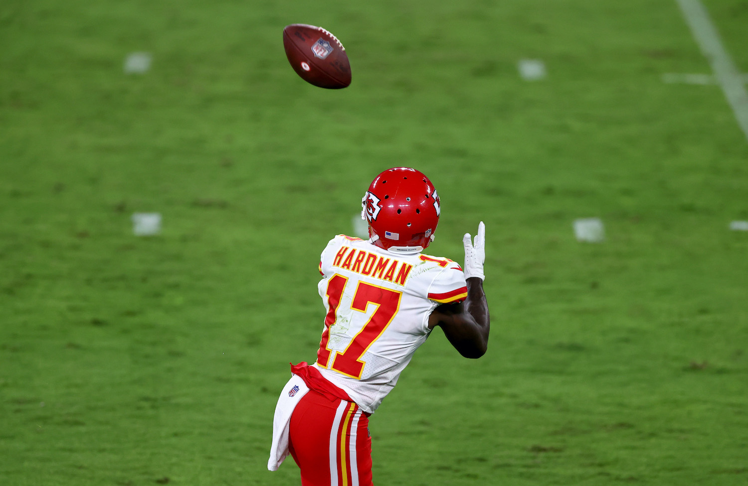 Kansas City Chiefs receiver Mecole Hardman runs under a touchdown pass from Patrick Mahomes.