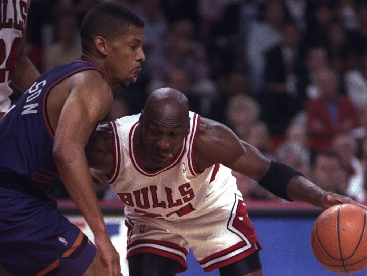 Michael Jordan of the Chicago Bulls battles Kevin Johnson of the Phoenix Suns in Game 5 of the 1993 NBA Finals