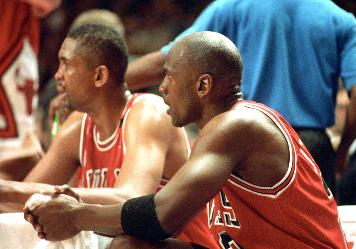 Michael Jordan sits next to Bill Cartwright on the bench during a game in 1993.
