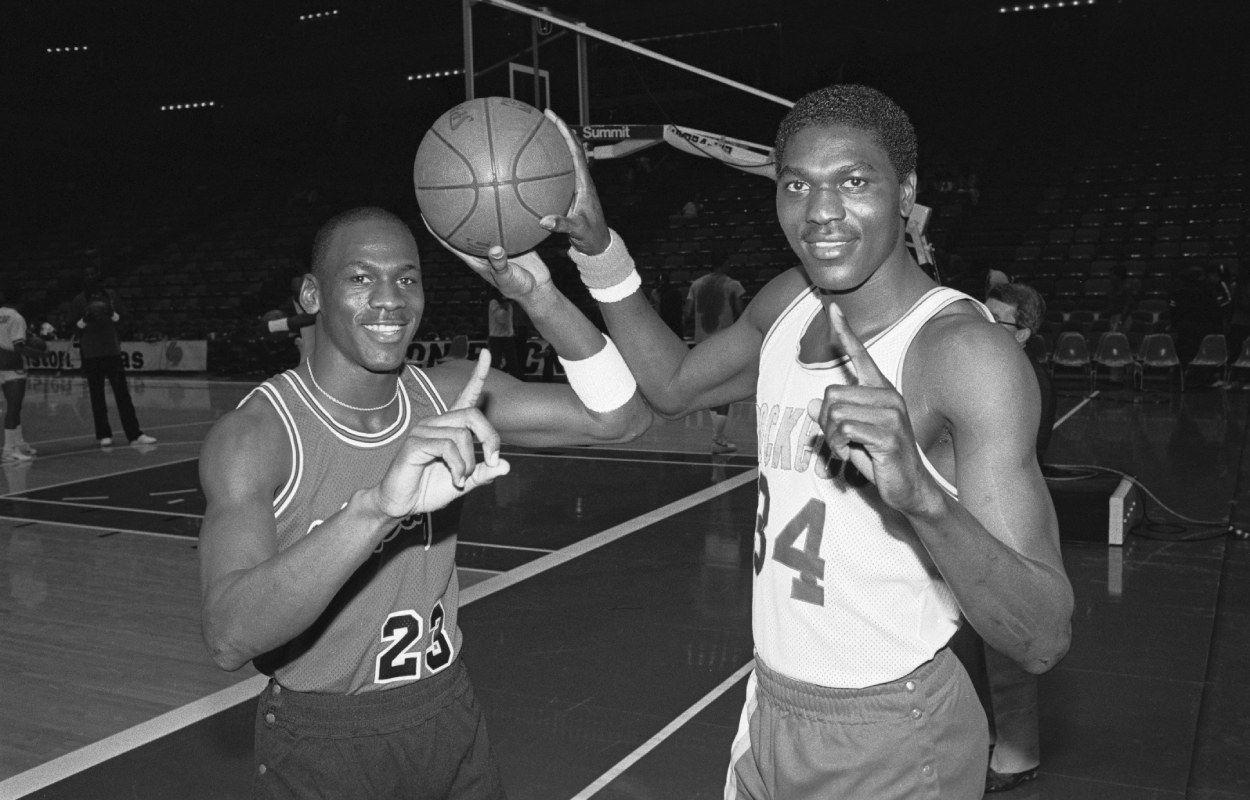 Michael Jordan and Akeem Olajuwon pose before a game during their rookie season.