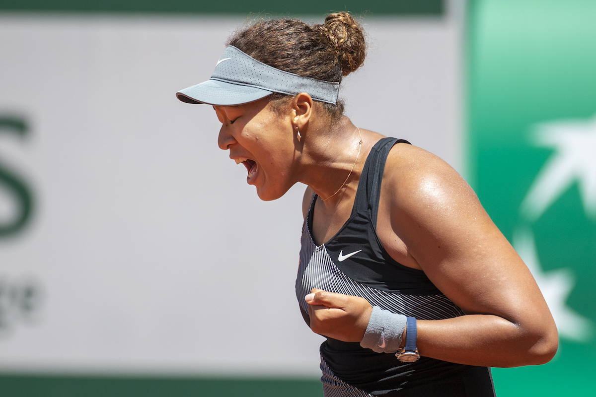 Naomi Osaka of Japan reacts to winning a point at the 2021 French Open