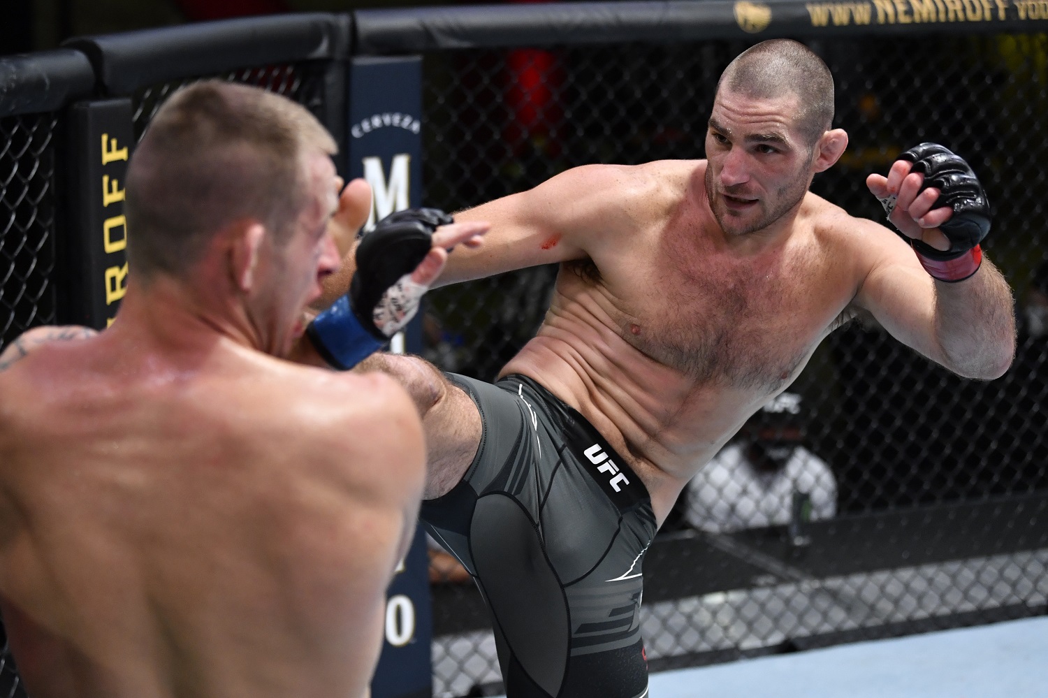 Sean Strickland kicks Krzysztof Jotko in a middleweight bout during the UFC Fight Night event at UFC APEX on May 1, 2021 in Las Vegas. | Jeff Bottari/Zuffa LLC/Getty Images