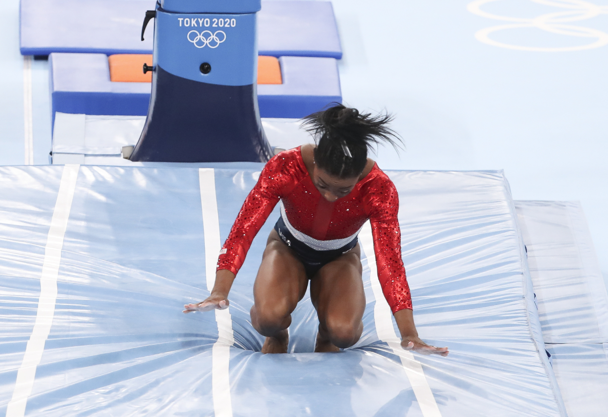 Simon Biles of USA falls before retiring from the event during the gymnastics artistic Women's Team Final.