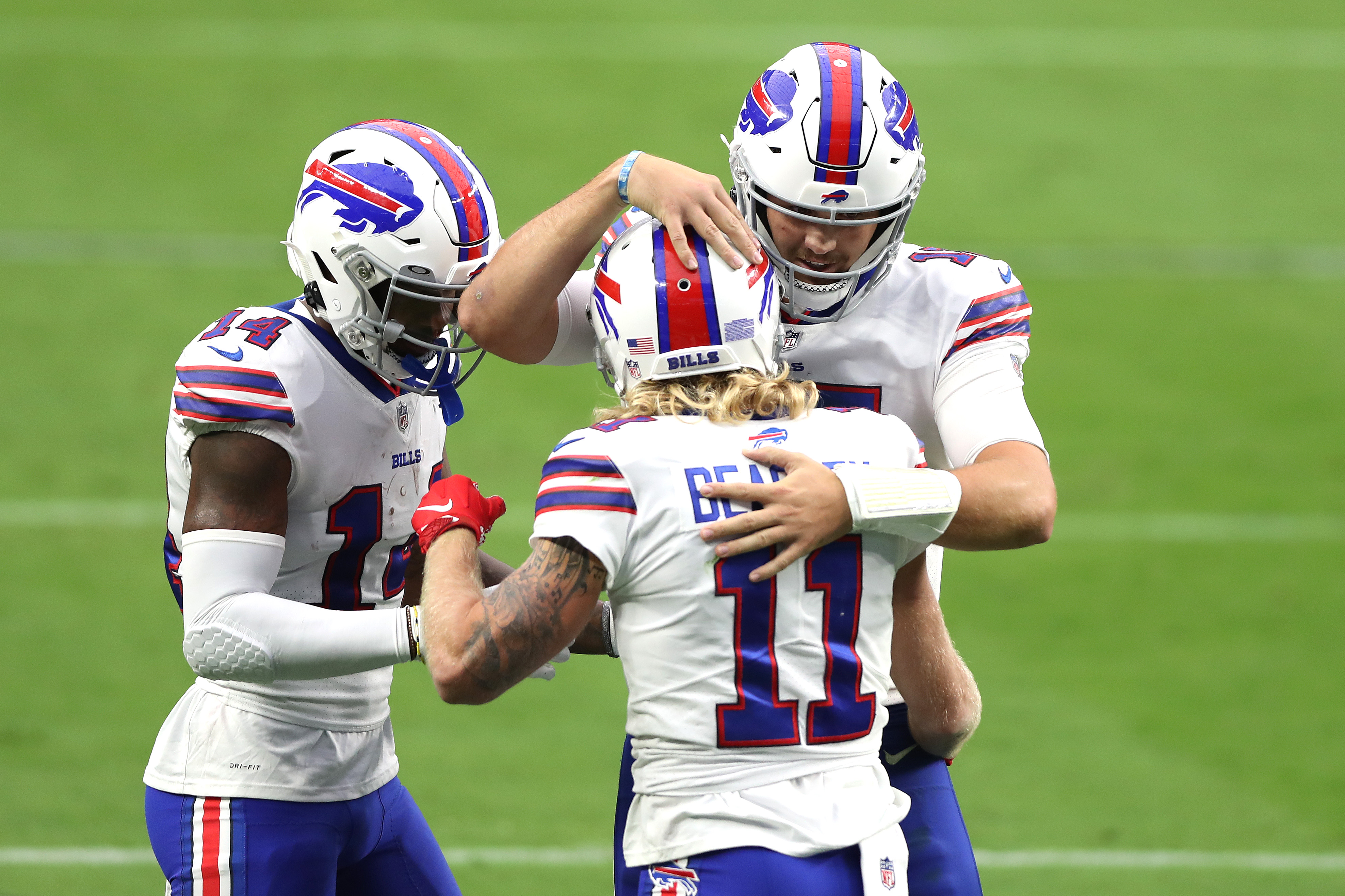Buffalo Bills stars Stefon Diggs and Josh Allen celebrate a Cole Beasley touchdown in a game in October of 2020.
