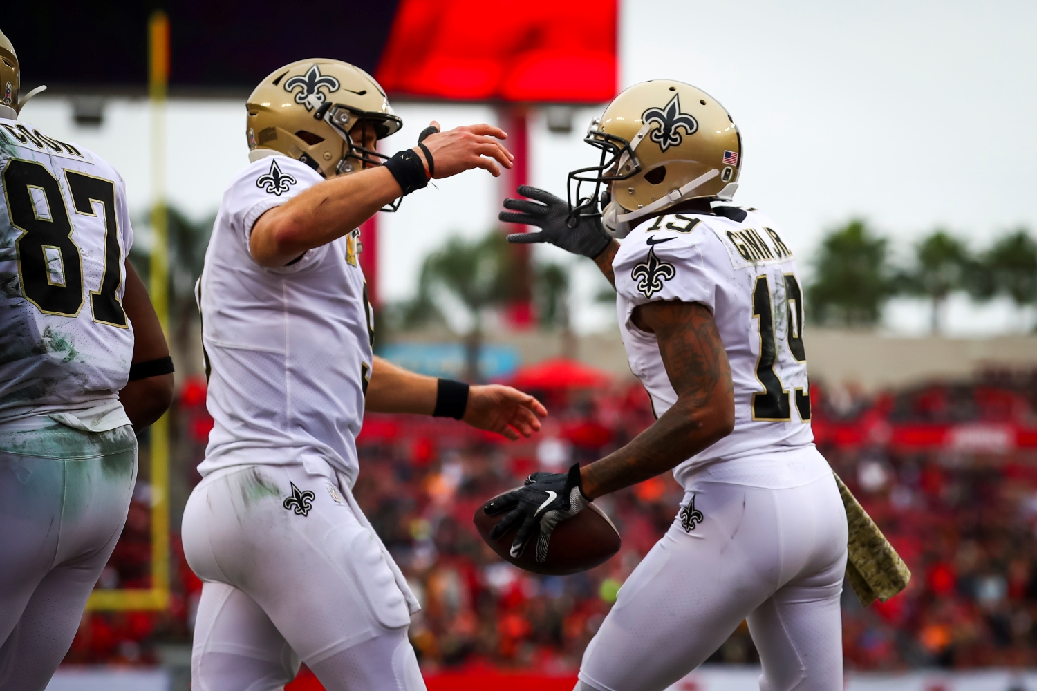New Orleans Saints teammates Drew Brees and Ted Ginn Jr. celebrate scoring a touchdown.