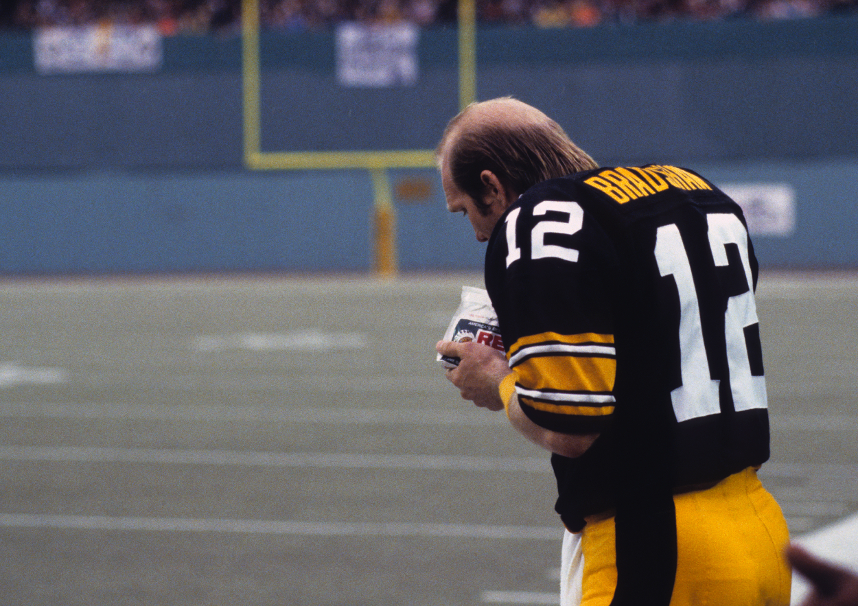 Terry Bradshaw gets some tobacco during a game in 1982.