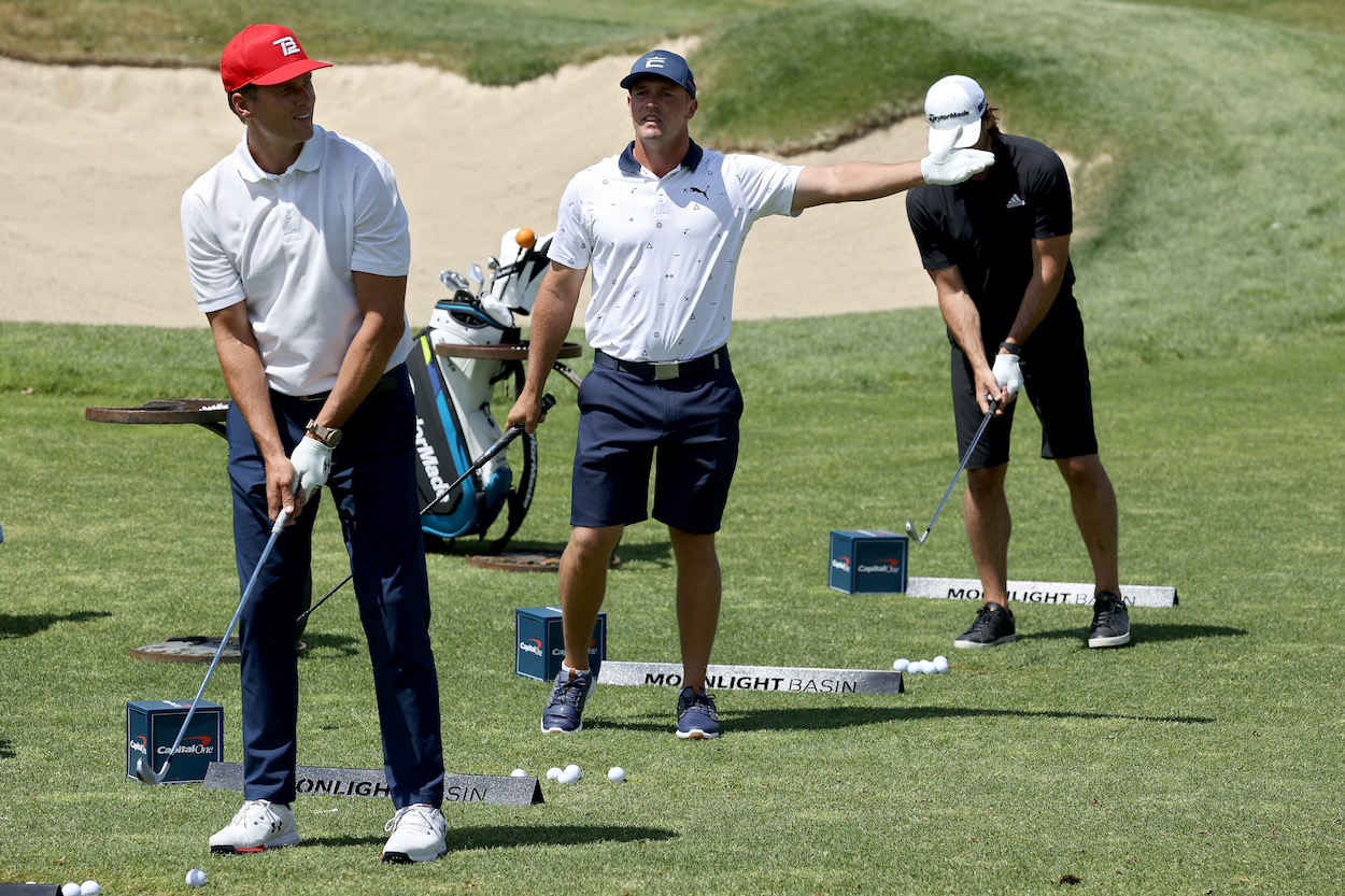 (L-R) Tom Brady, Bryson DeChambeau, and Aaron Rodgers participate in a chipping contest during Capital One's The Match at The Reserve at Moonlight Basin on July 06, 2021 in Big Sky, Montana.