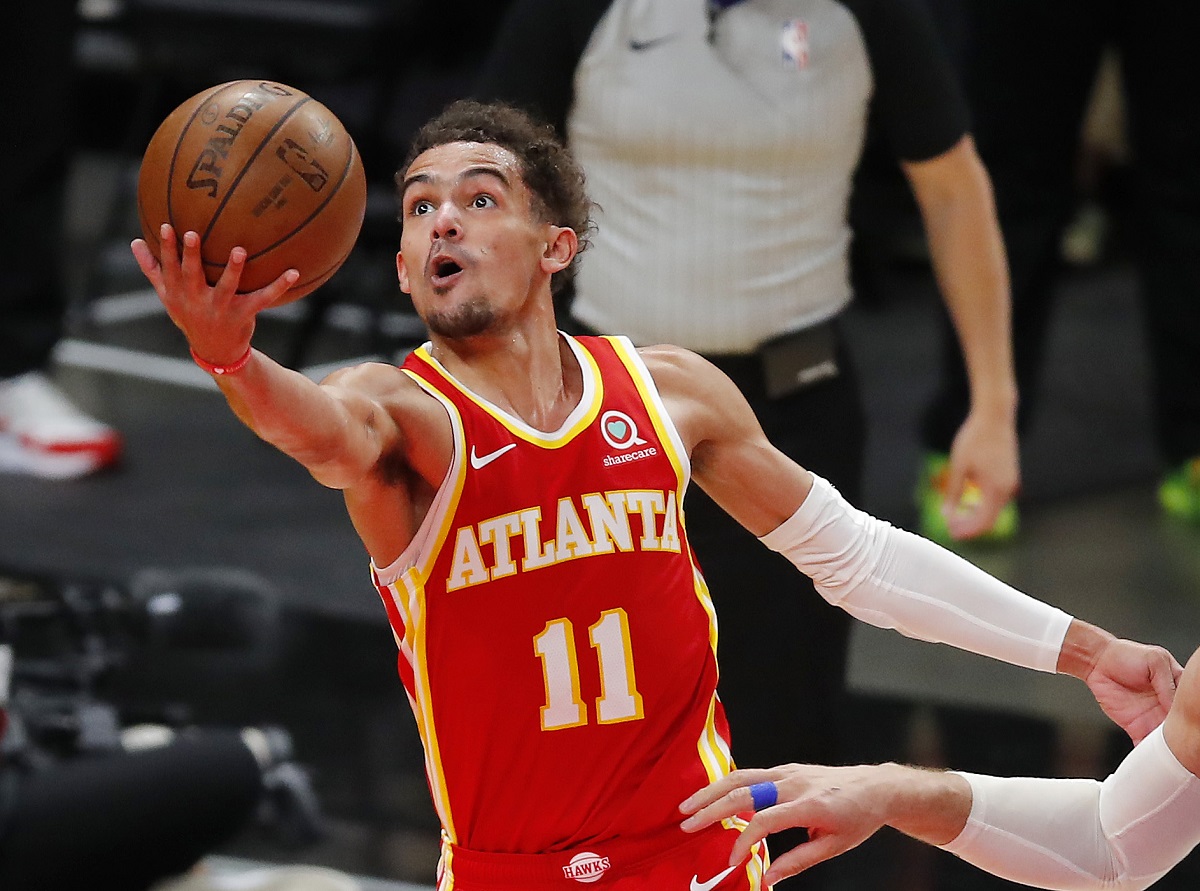 Atlanta Hawks Trae Young taking a shot against the Milwaukee Bucks .