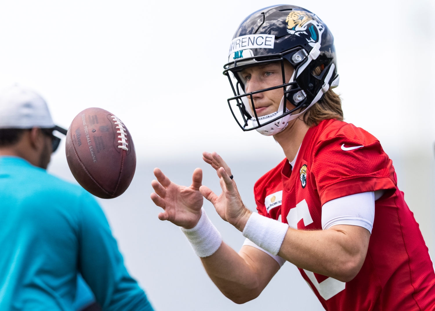 Trevor Lawrence gets ready to receive the ball during Jacksonville Jaguars practice.