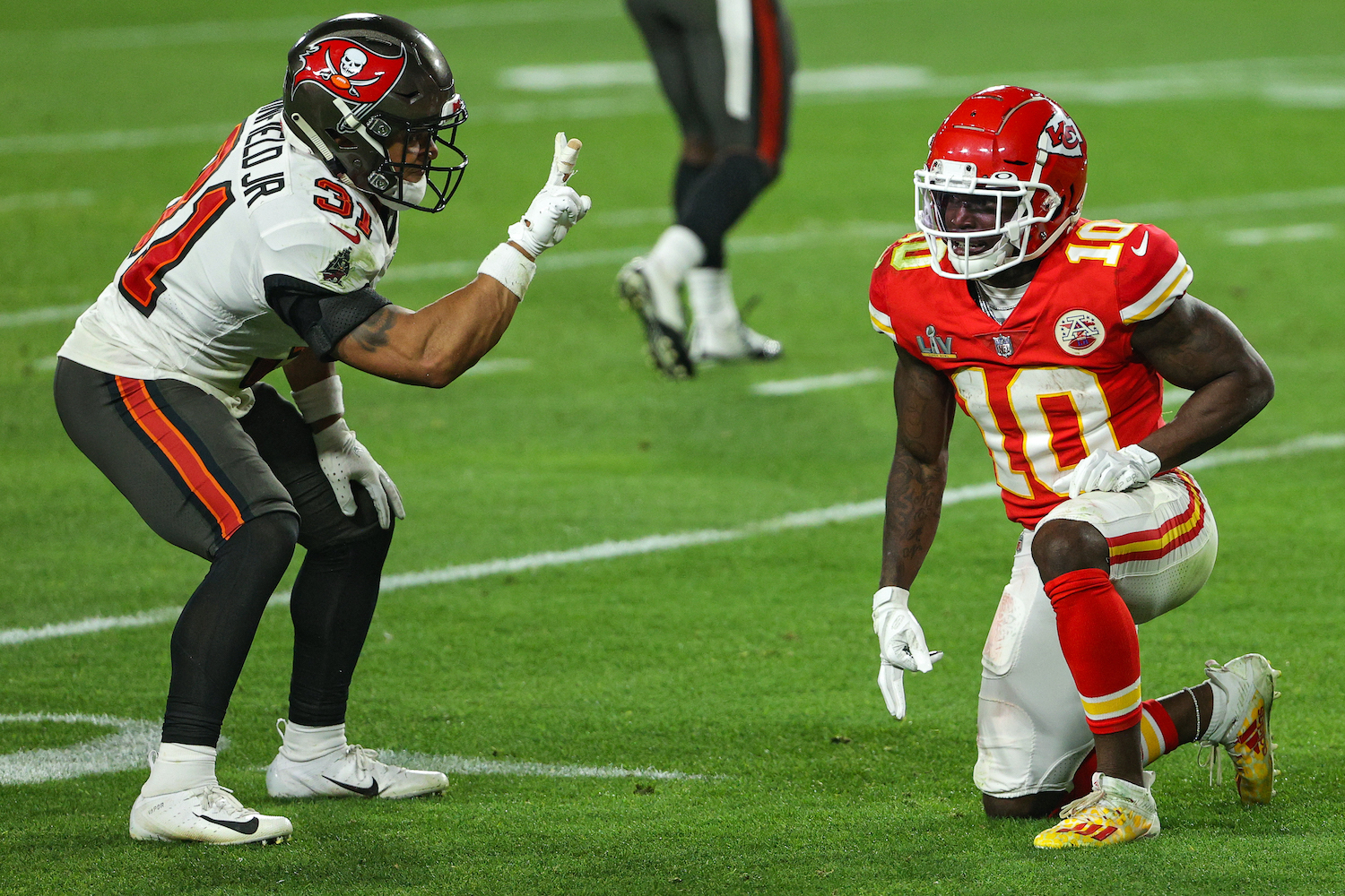 Antoine Winfield Jr. (L) taunts Kansas City Chiefs receiver Tyreek Hill during Super Bowl 55.