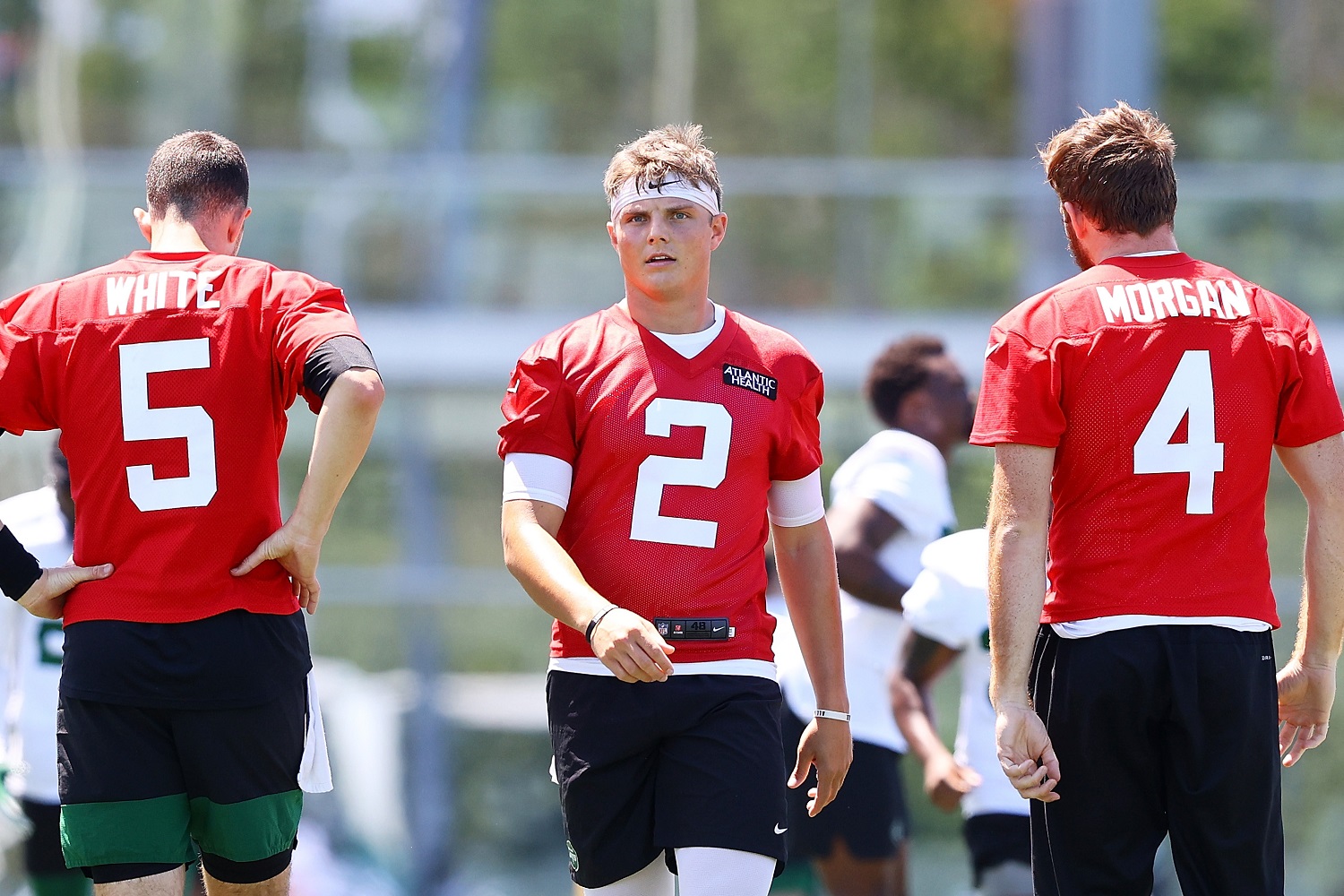 Quarterbacks Mike White, Zach Wilson, and James Morgan of the New York Jets look on during a minicamp practice in Florham Park, New Jersey. | Mike Stobe/Getty Images