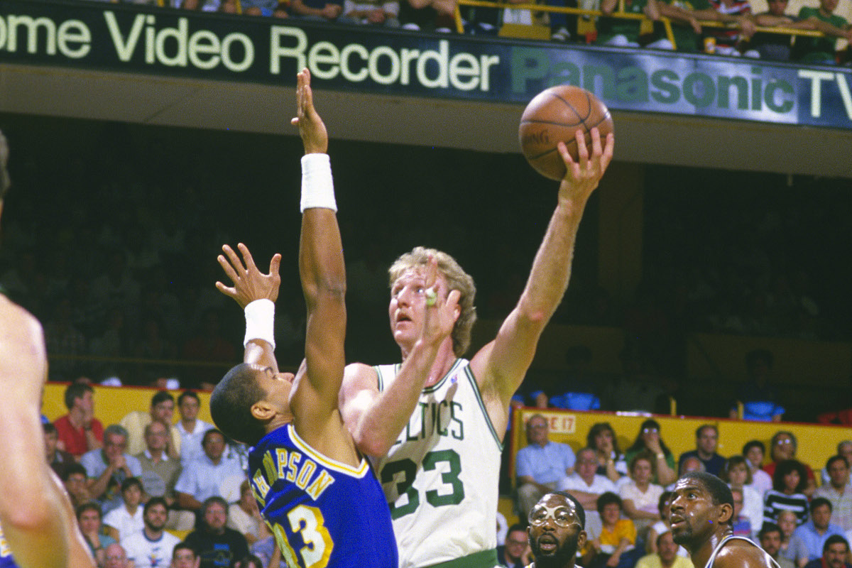 Larry Bird takes a left-handed shot