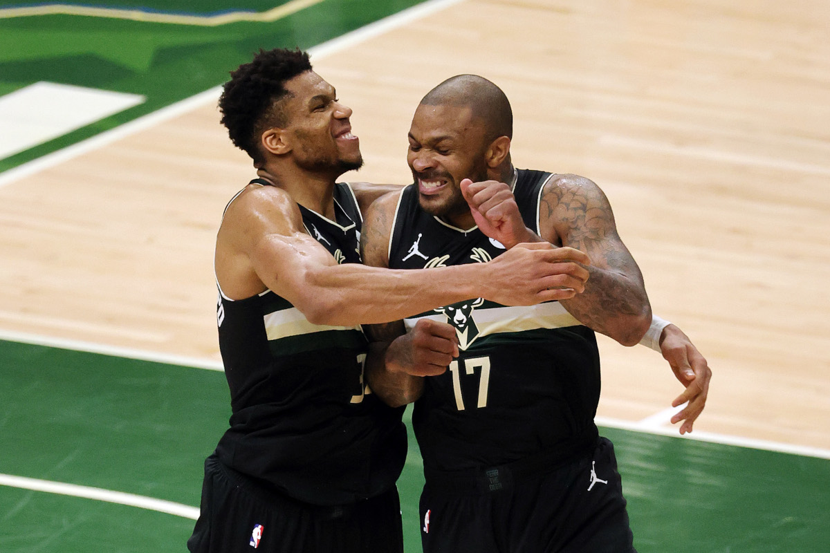 P.J. Tucker celebrates the Milwaukee Bucks' NBA title with Giannis Antetokounmpo