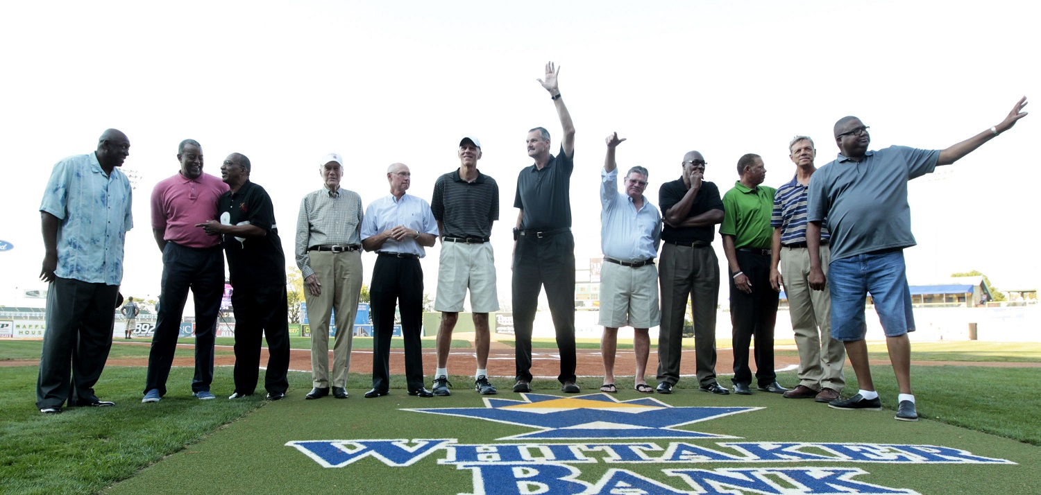 Members of the 1972 Olympic basketball team (from left) Jim Brewer, Mike Bantom, Tom Henderson, John Bach (assistant coach), Kenny Davis, Bobby Jones, Tom Burleson, Kevin Joyce, Jim Forbes, Ed Ratleff, John Brown (assistant coach) and Dwight Jones are introduced before the Lexington Legends baseball game at Whitaker Bank Ballpark in Lexington, Kentucky, on Aug. 23, 2012. | Pablo Alcala/Lexington Herald-Leader/Tribune News Service via Getty Images