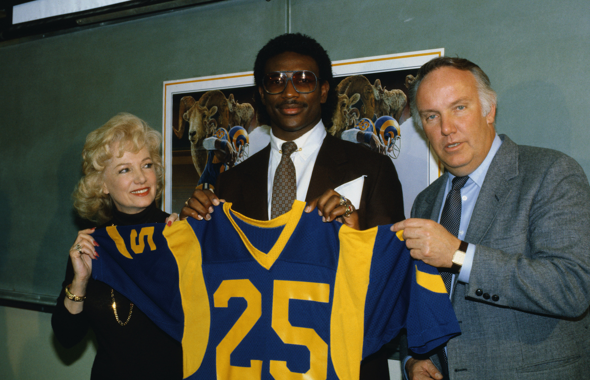 NFL Player Eric Dickerson poses with ownership of the Rams after he was selected in the first round by the team
