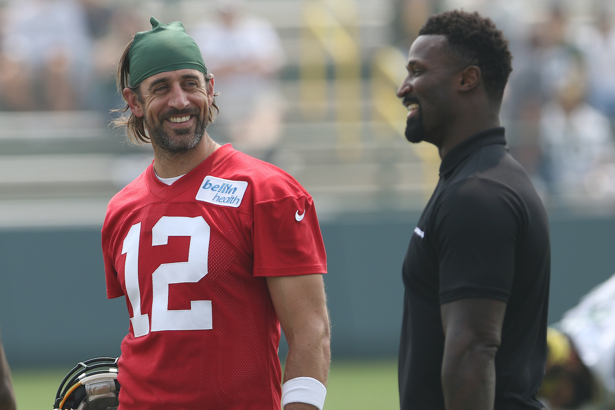 Green Bay Packers quarterback Aaron Rodgers talks with NFL Network host James Jones during 2021 Training Camp at Ray Nitschke Field on July 31, 2021 in Ashwaubenon, WI.