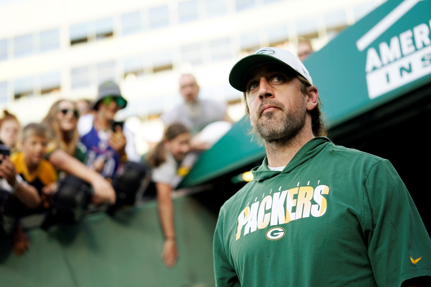 Green Bay Packers quarterback Aaron Rodgers walks onto the field before a preseason game.