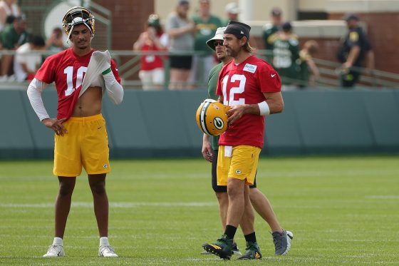 Jordan Love and Aaron Rodgers of the Green Bay Packers work out during training camp at Ray Nitschke Field on July 28, 2021 in Ashwaubenon, Wisconsin.