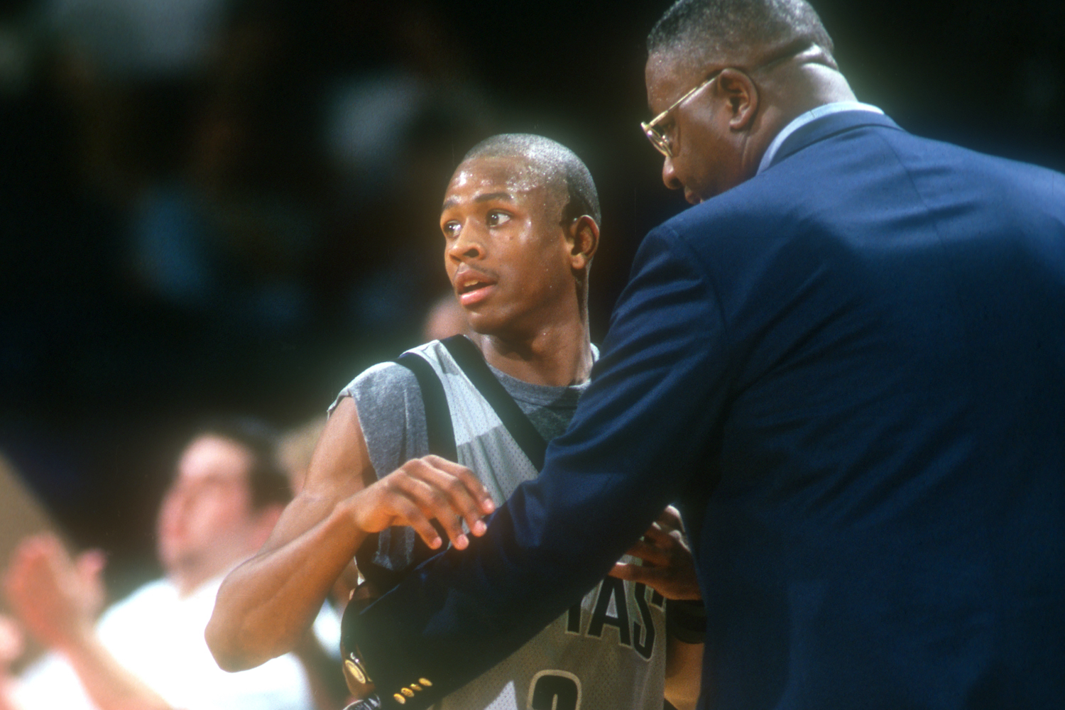 Head coach John Thompson hold Allen Iverson during their time together at Georgetown.