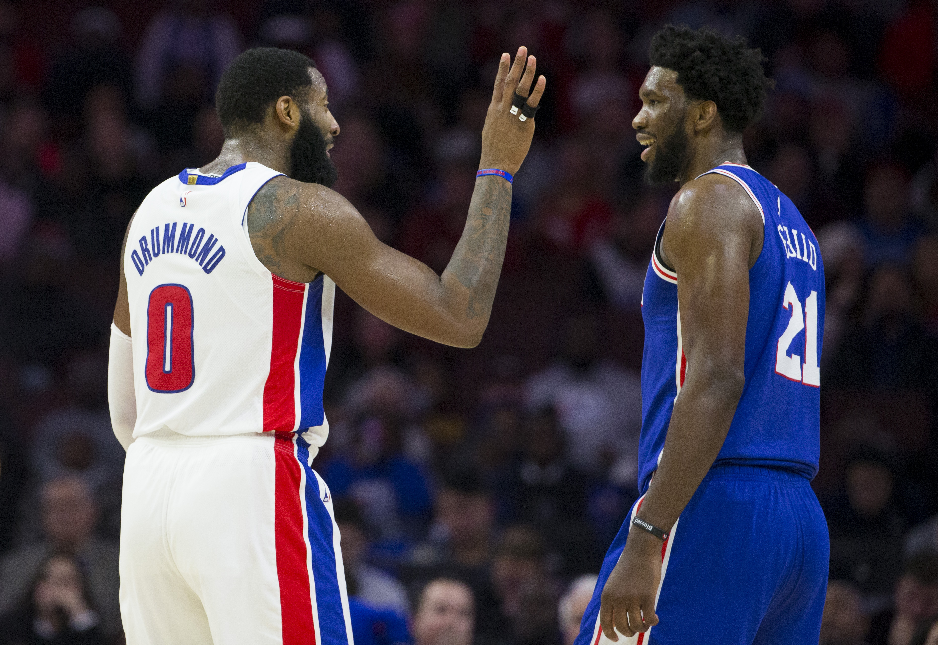 Andre Drummond and Joel Embiid talk during a game in December of 2018