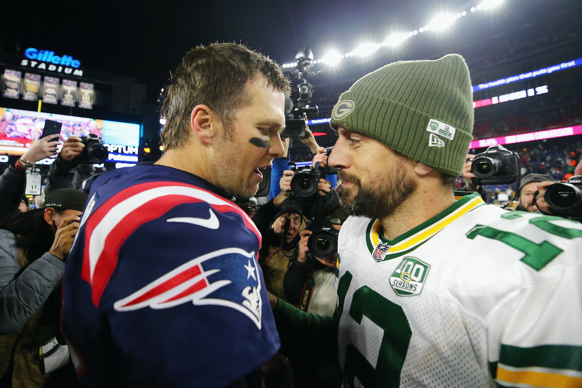 Aaron Rodgers and Tom Brady, two of the best NFL players in the modern league, talk after a game