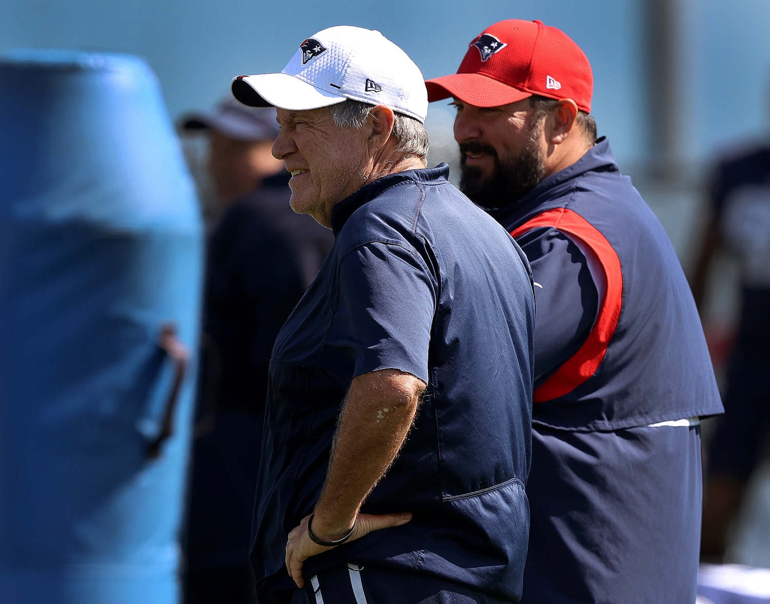 New England Patriots head coach Bill Belichick watches training camp practice with Matt Patricia.