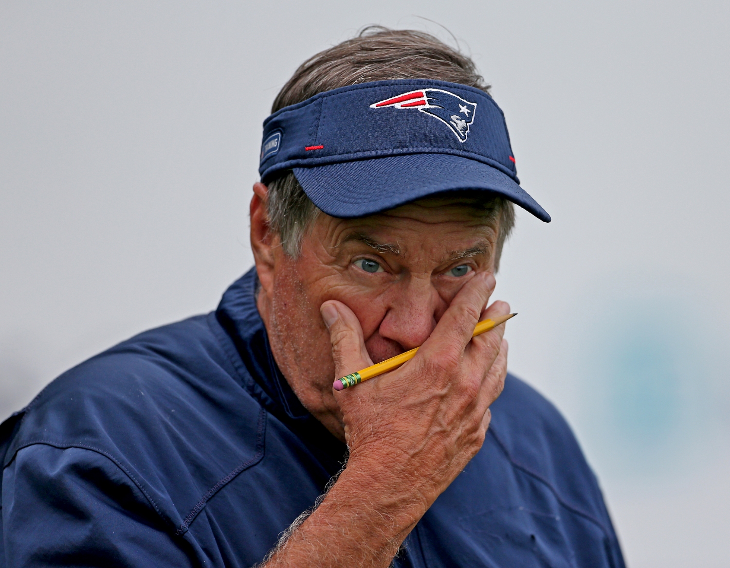 New England Patriots head coach Bill Belichick watches training camp.