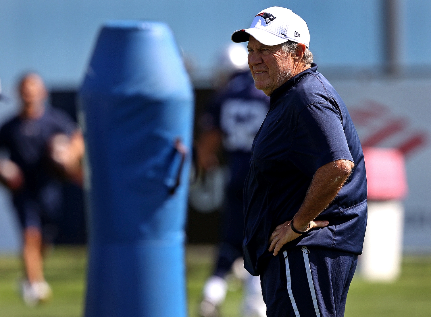 New England Patriots head coach Bill Belichick watches his team during training camp practice.