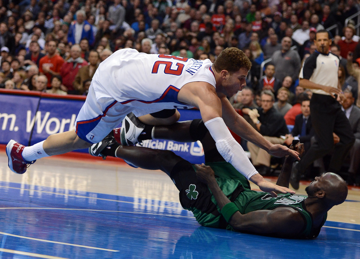 Blake Griffin of the Los Angeles Clippers knocks over Kevin Garnett of the Boston Celtics during a 106-77 15th straight Clipper win at Staples Center on December 27, 2012 in Los Angeles, California.