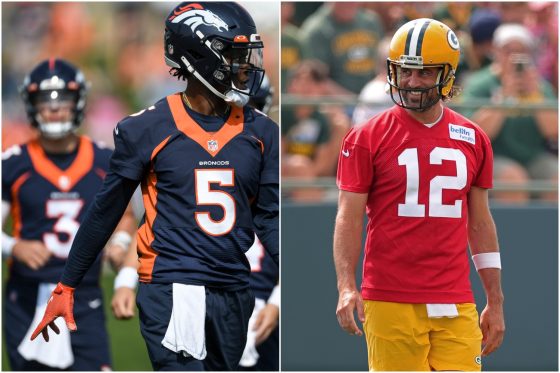 Denver Broncos quarterbacks Teddy Bridgewater (#5) and Drew Lock (#3) go through drills in practice as Green Bay Packers quarterback Aaron Rodgers smiles during his first day of training camp.