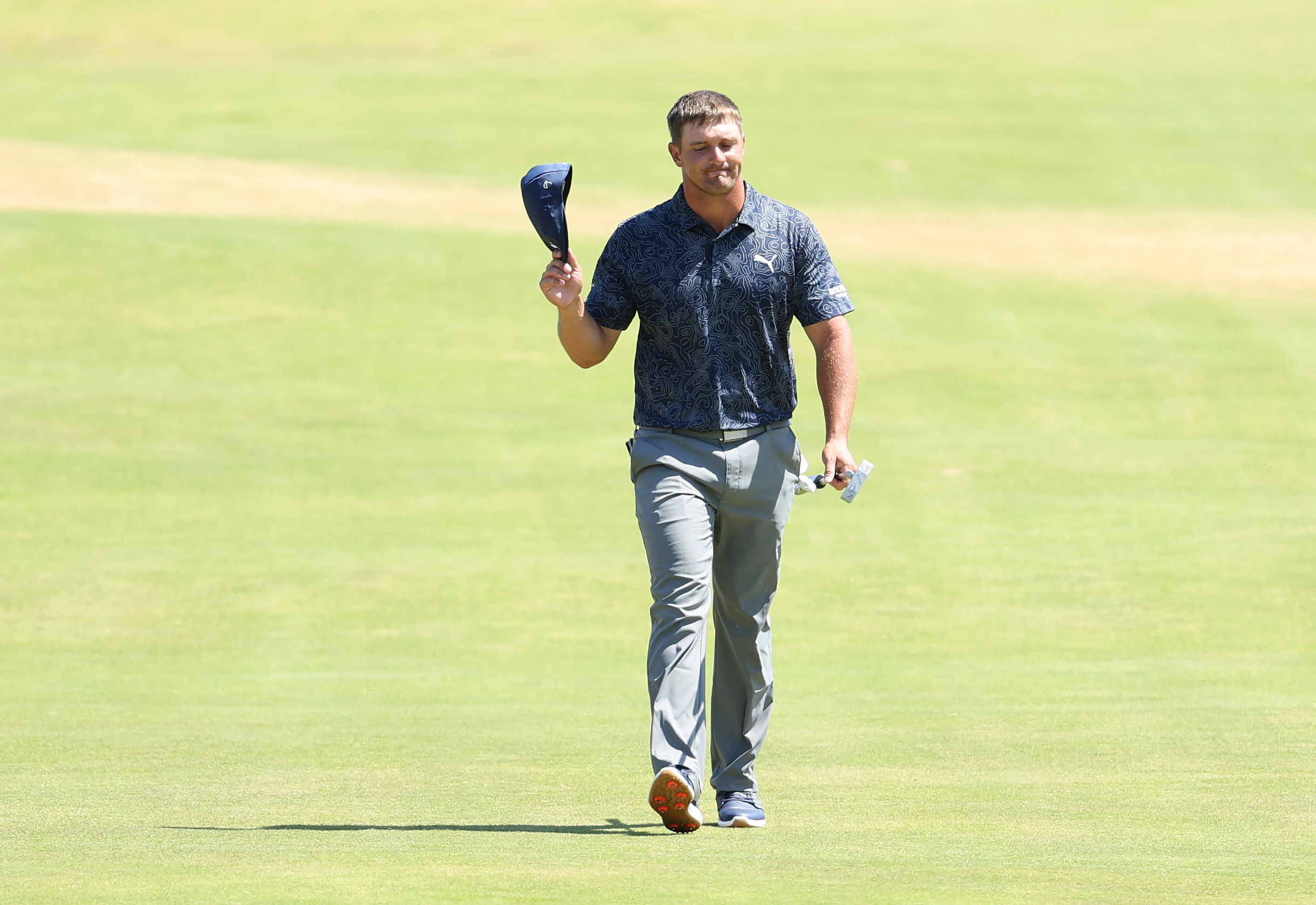 Bryson DeChambeau walks up the 18th hole at the 2021 British Open