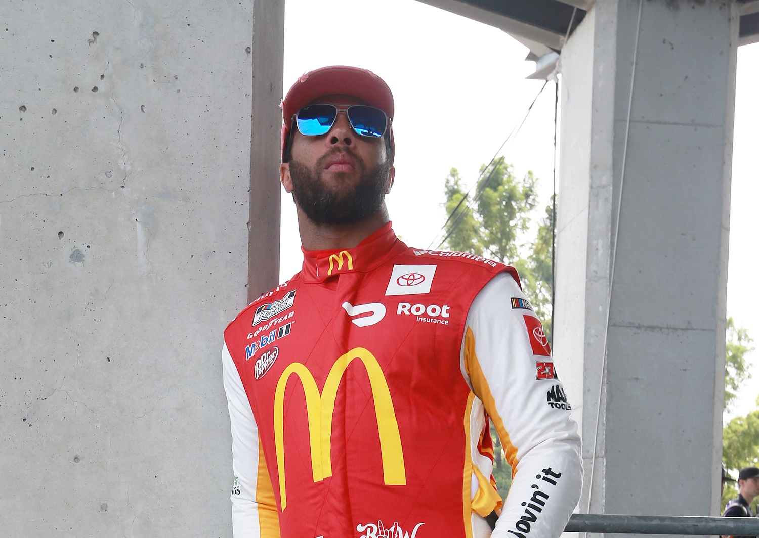 Bubba Wallace, driver of the No. 23 Toyota for 23XI Racing, waits on the grid prior to the NASCAR Cup Series Verizon 200 at Indianapolis Motor Speedway. | Sean Gardner/Getty Images