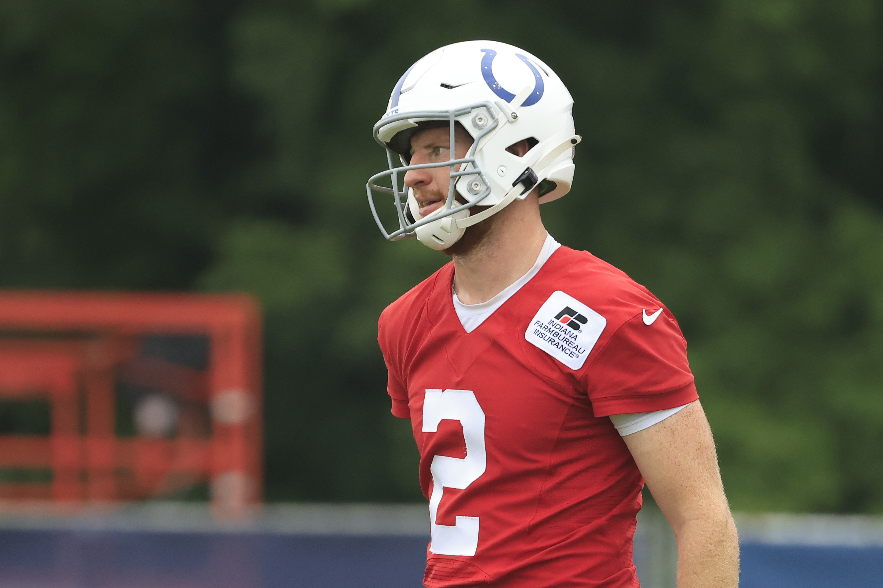Colts quarterback Carson Wentz warms up at training camp