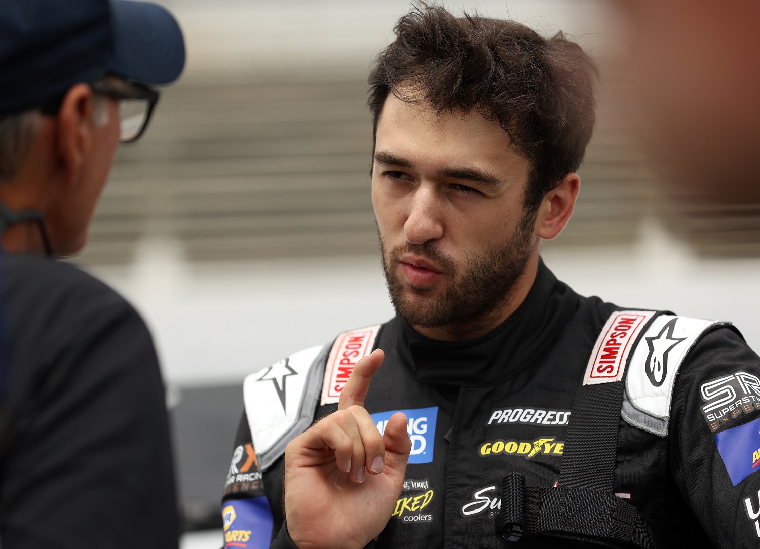 Chase Elliotttalks with Ray Evernham on the grid during practice prior to the Camping World Superstar Racing Experience event at Nashville Fairgrounds Speedway. | Dylan Buell/SRX via Getty Images