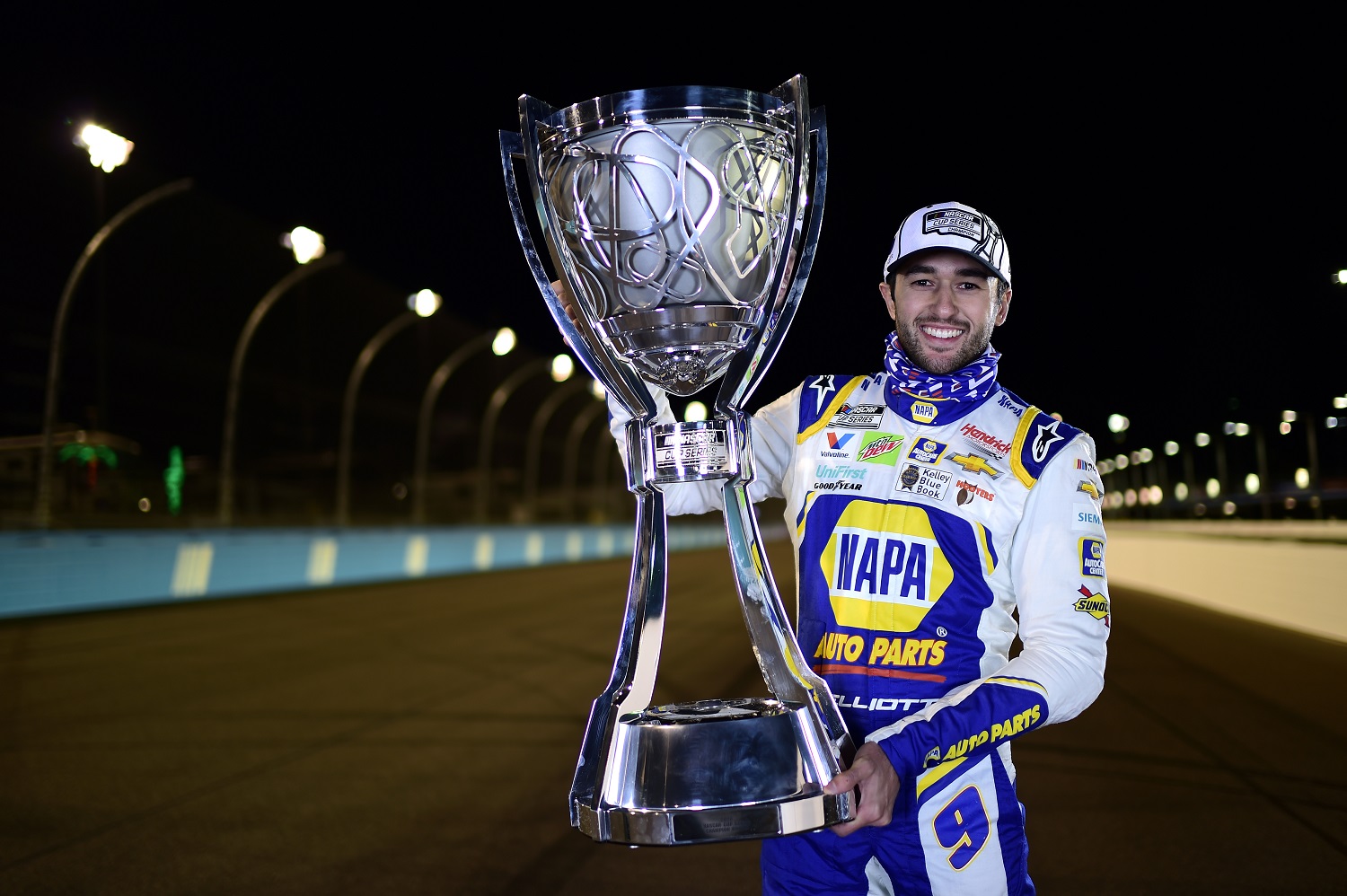 Chase Elliott poses for photos after winning the NASCAR Cup Series crown at Phoenix Raceway on Nov. 8, 2020.