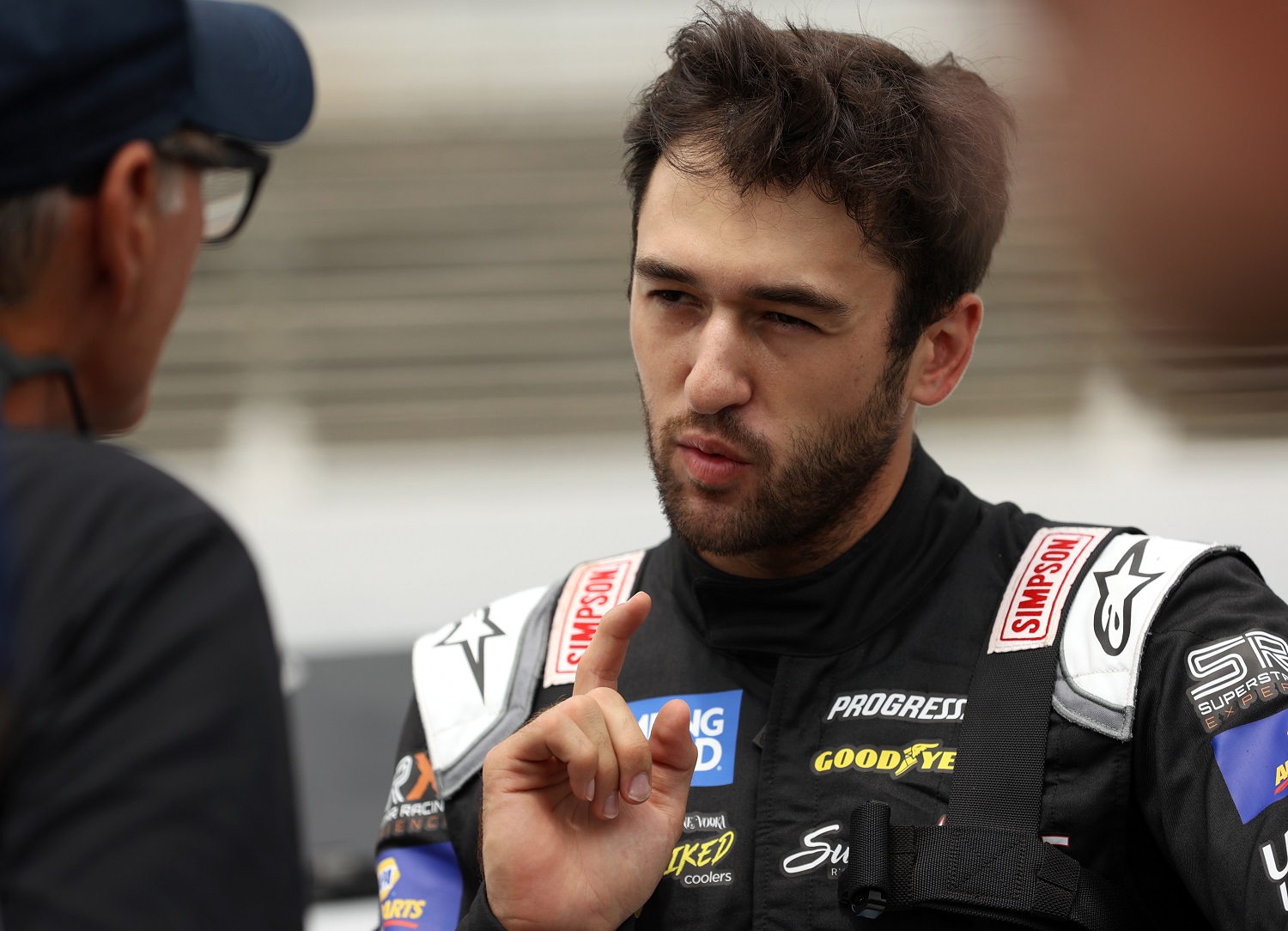 Chase Elliott talks with Ray Evernham on the grid during practice prior to the Camping World Superstar Racing Experience event at Nashville Fairgrounds Speedway on July 17, 2021.