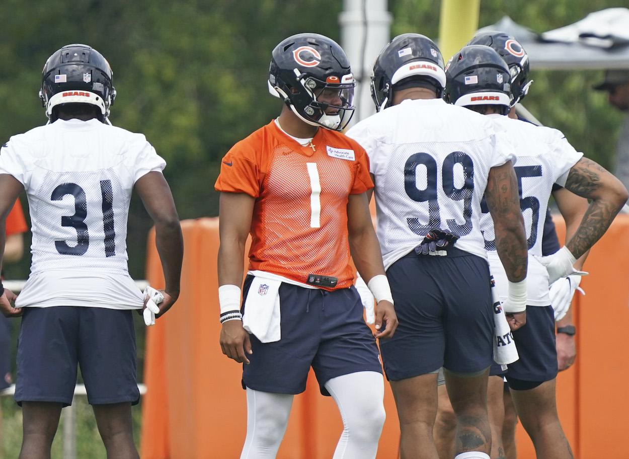 Justin Fields of the Chicago Bears stands on the field during the Chicago Bears training camp at Halas Hall on July 28, 2021 in Lake Forest, Illinois.