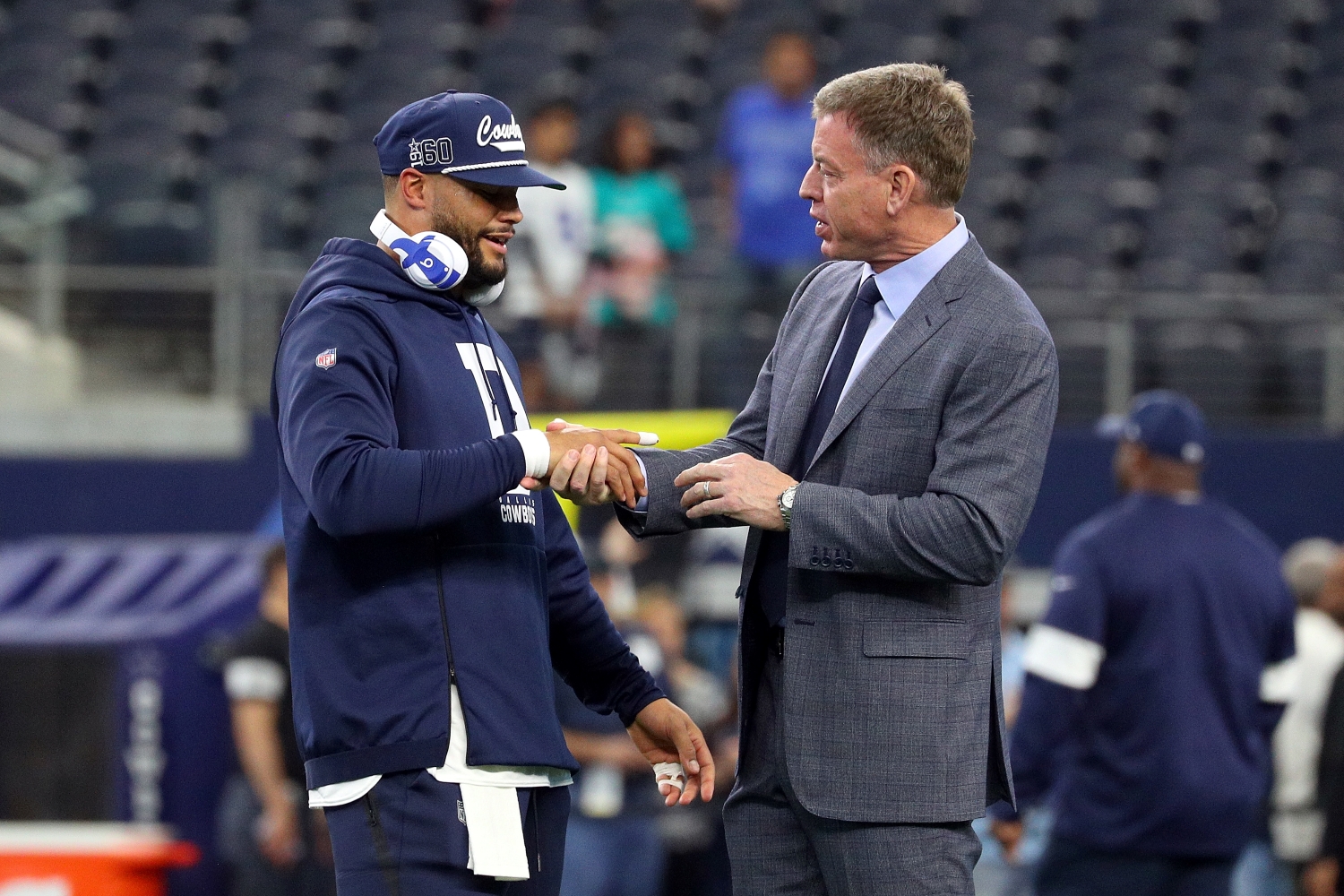Dallas Cowboys quarterback Dak Prescott shakes hands with FOX sportscaster and former Cowboys quarterback Troy Aikman.