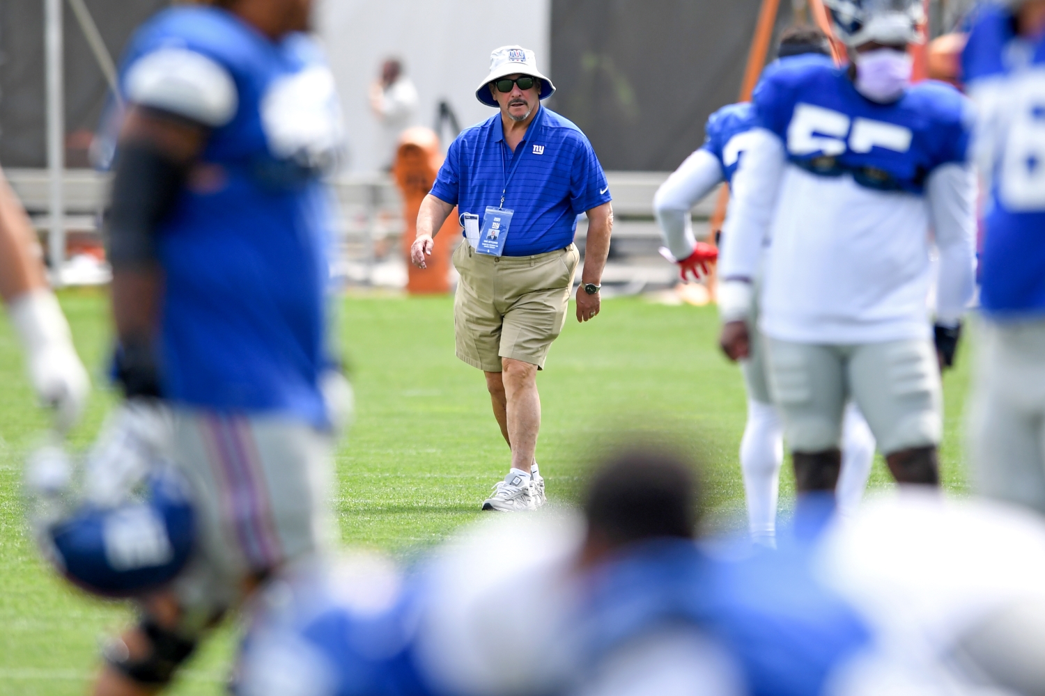 New York Giants general manager Dave Gettleman watches training camp practice.