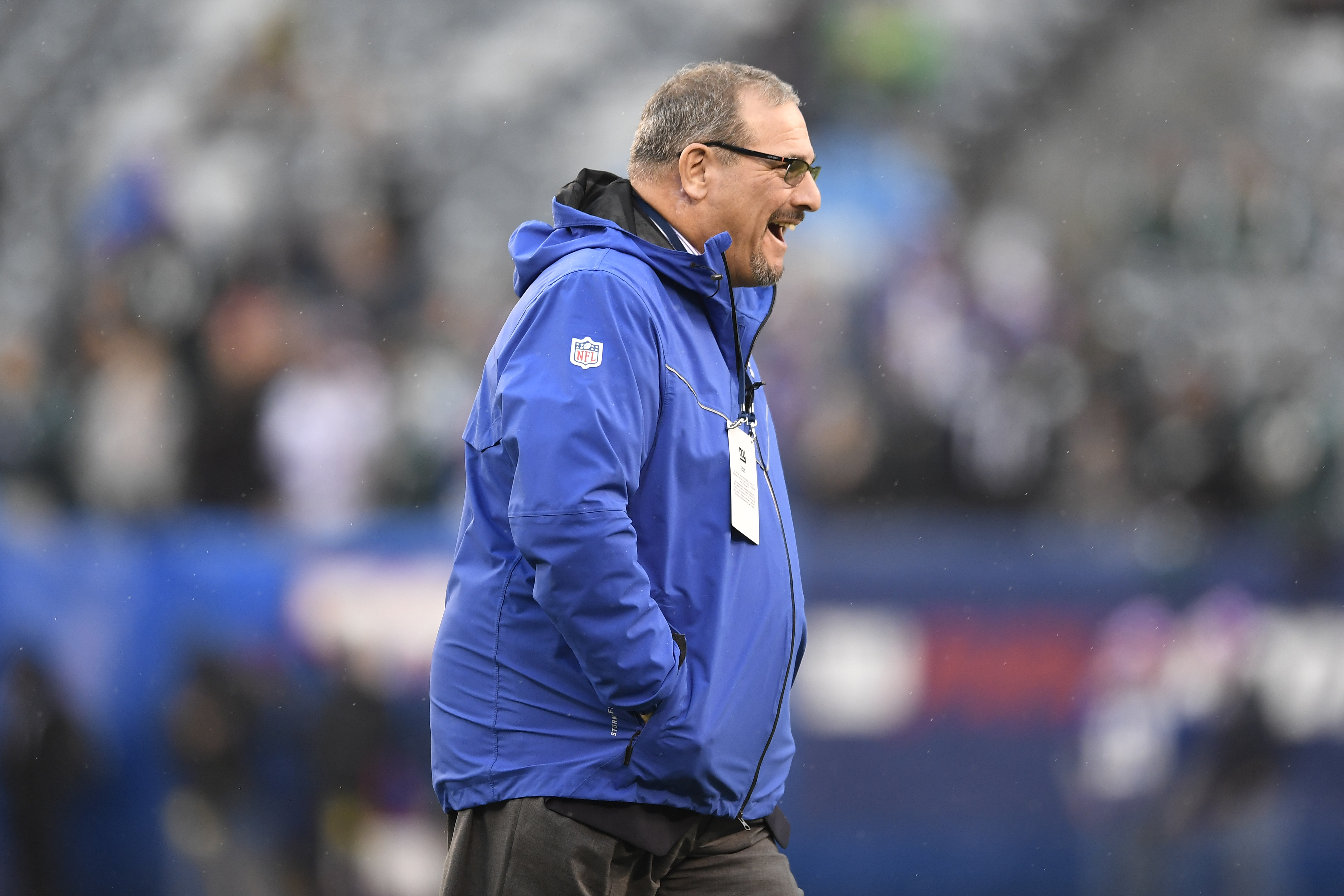 New York Giants general manager Dave Gettleman walks around before a game in 2019
