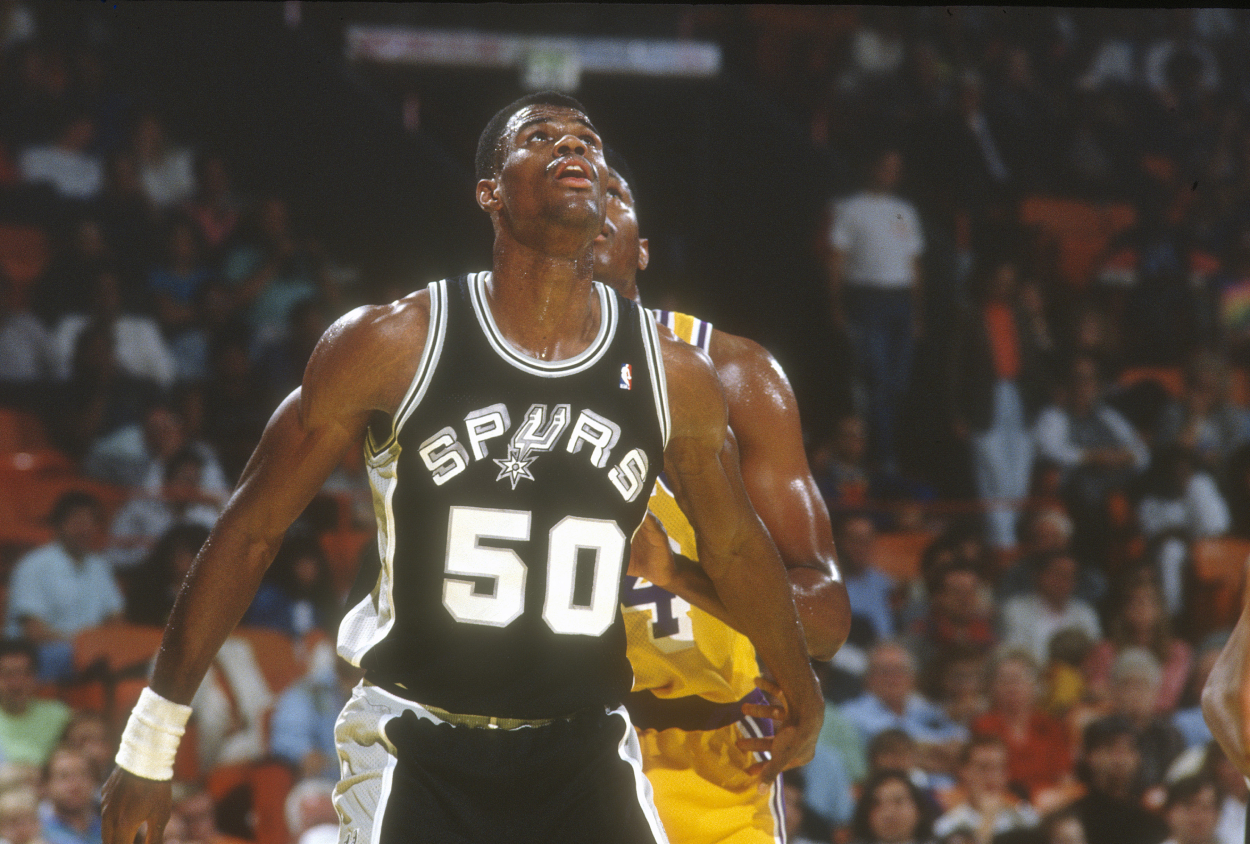 David Robinson #50 of the San Antonio Spurs battles for position with Sam Perkins.