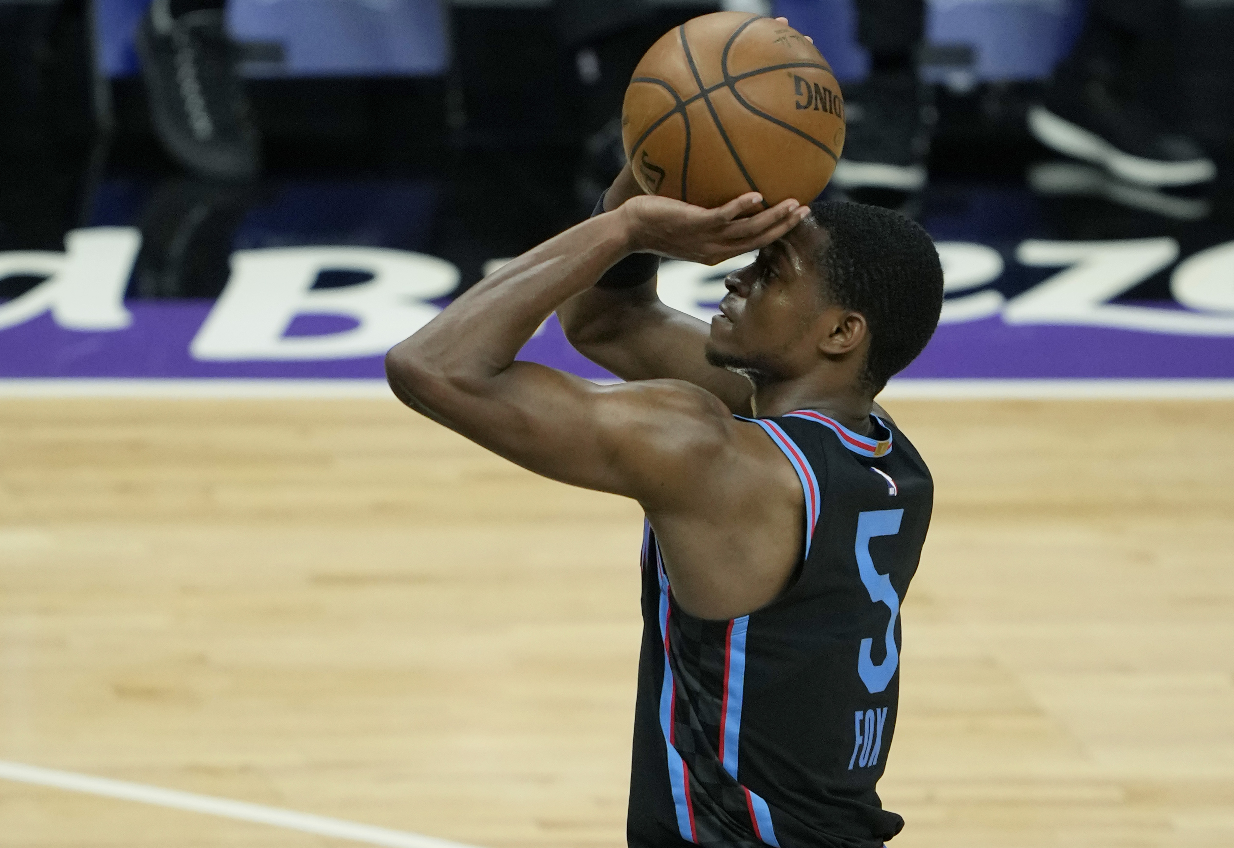 Kings guard De'Aaron Fox shoots the ball during a game in April