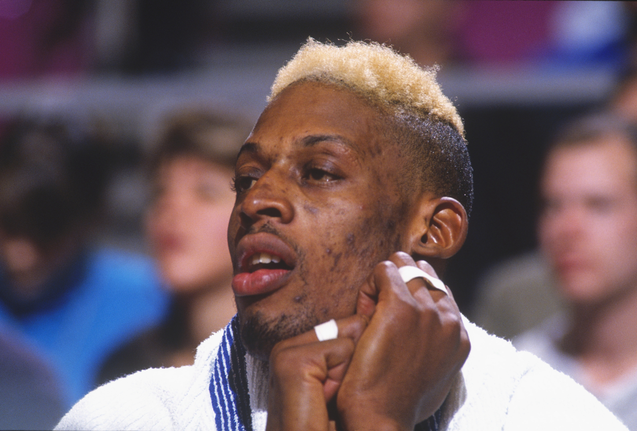 Dennis Rodman of the San Antonio Spurs watches from the bench in 1993.