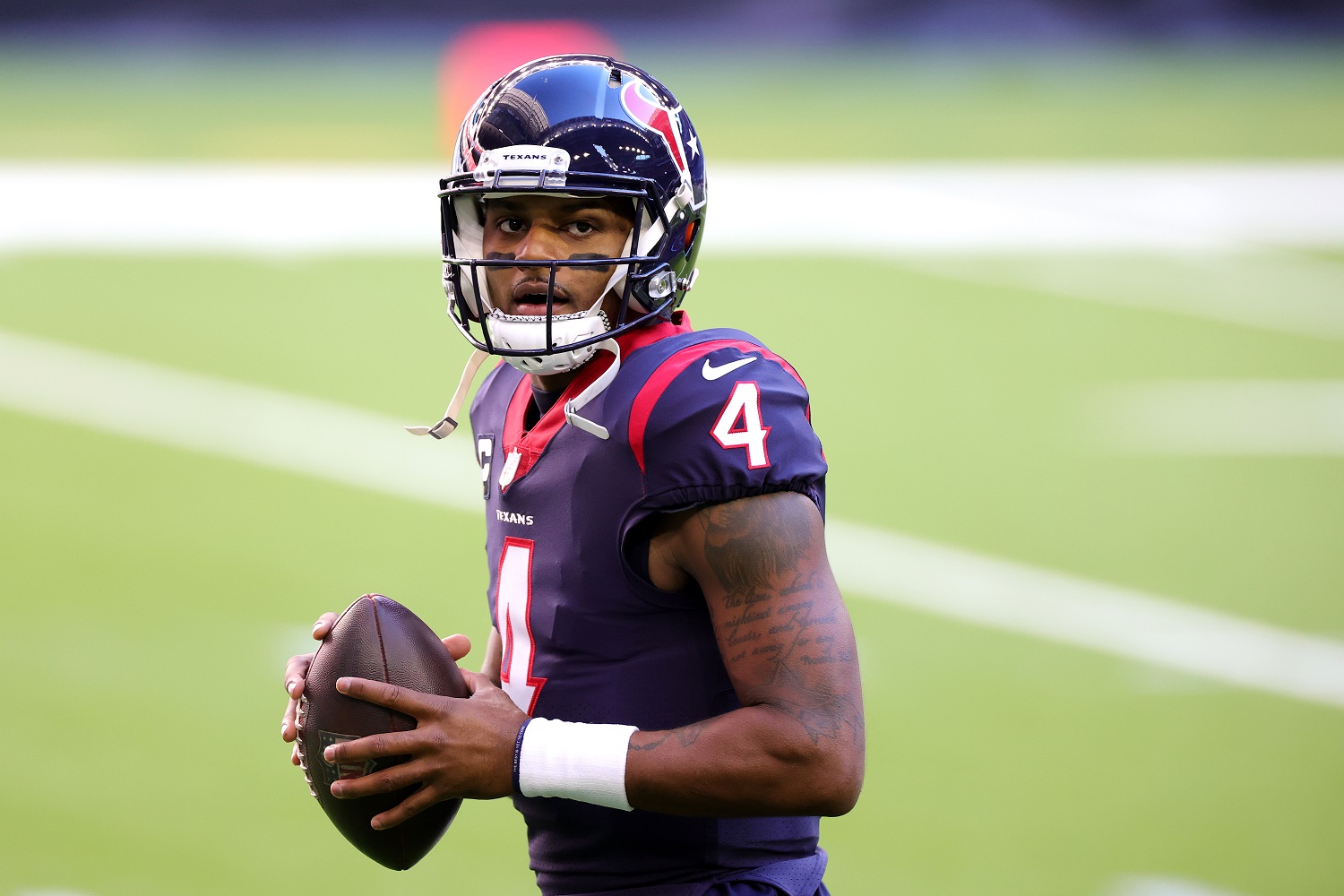 Deshaun Watson of the Houston Texans in action against the Tennessee Titans on Jan. 3, 2021, in Houston.