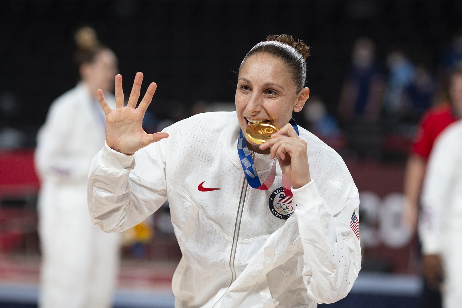 Five-time Olympic gold medalist Diana Taurasi celebrates at the medal presentation after Team USA defeated Japan in the women's basketball final at the Tokyo Olympics. | Tim Clayton/Corbis via Getty Images