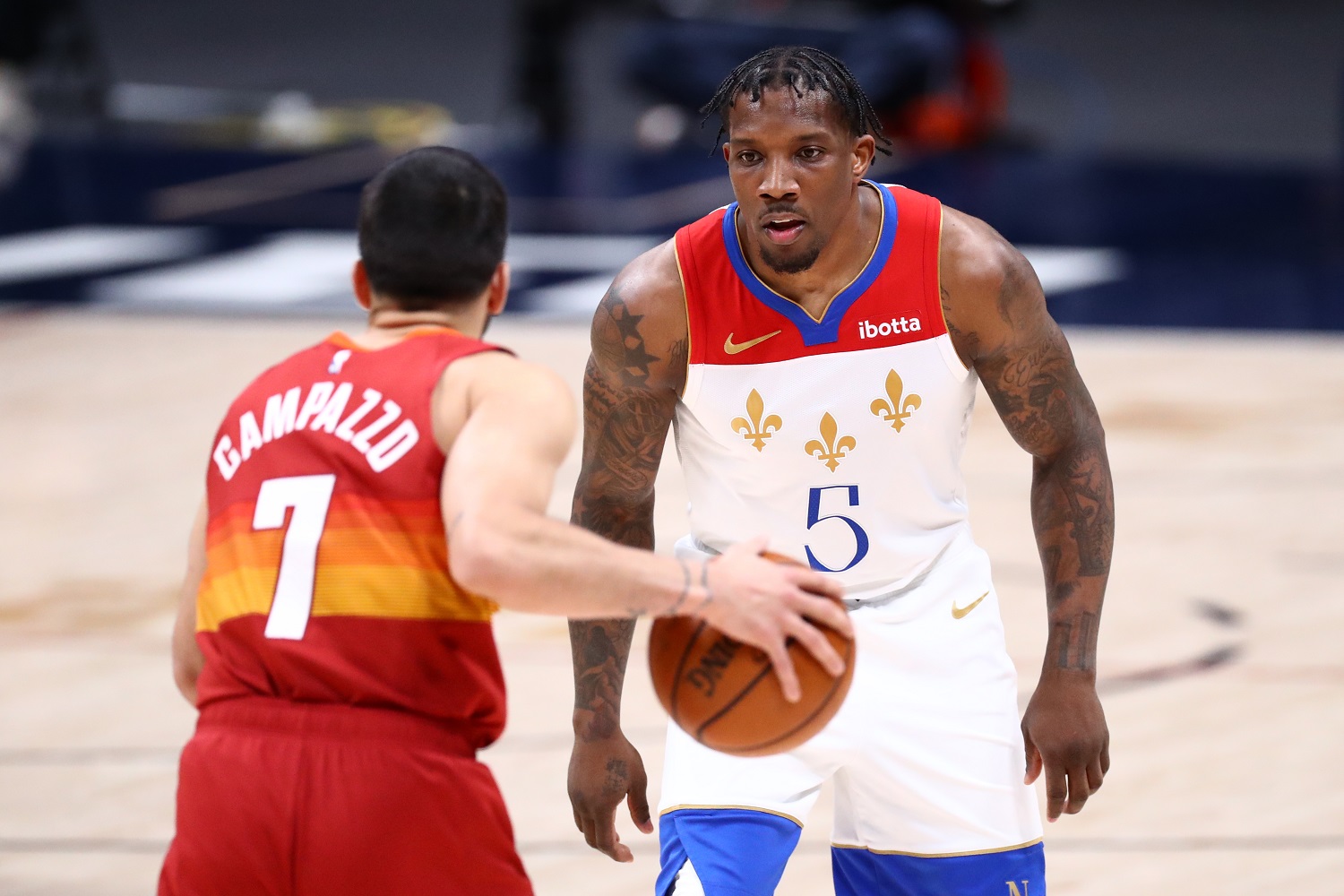 Eric Bledsoe of the New Orleans Pelicans defends Facundo Campazzo of the Denver Nuggets on April 28, 2021, in Denver.