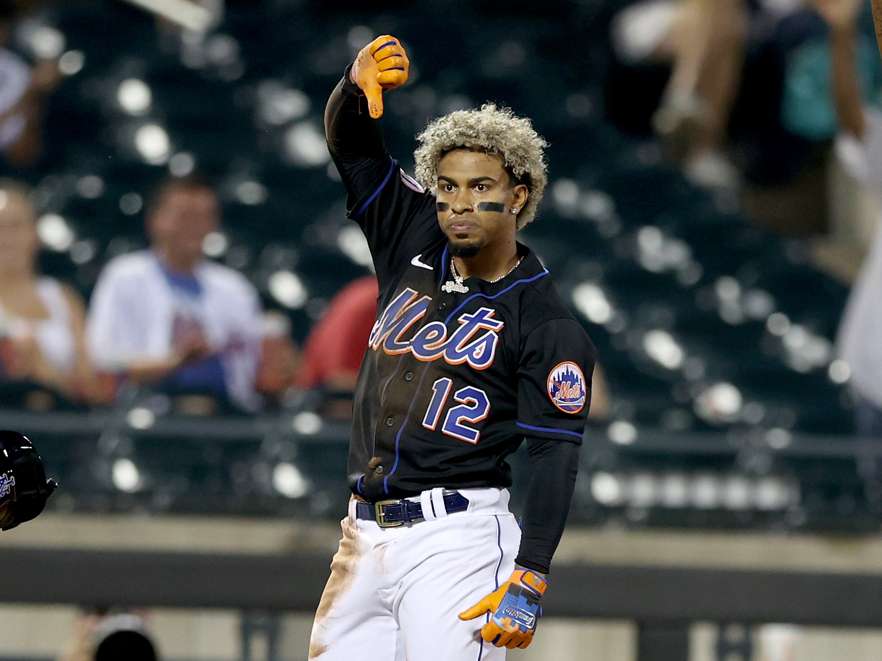 Mets shortstop Francisco Lindor makes the thumbs-down after a triple in a game against the Washington Nationals