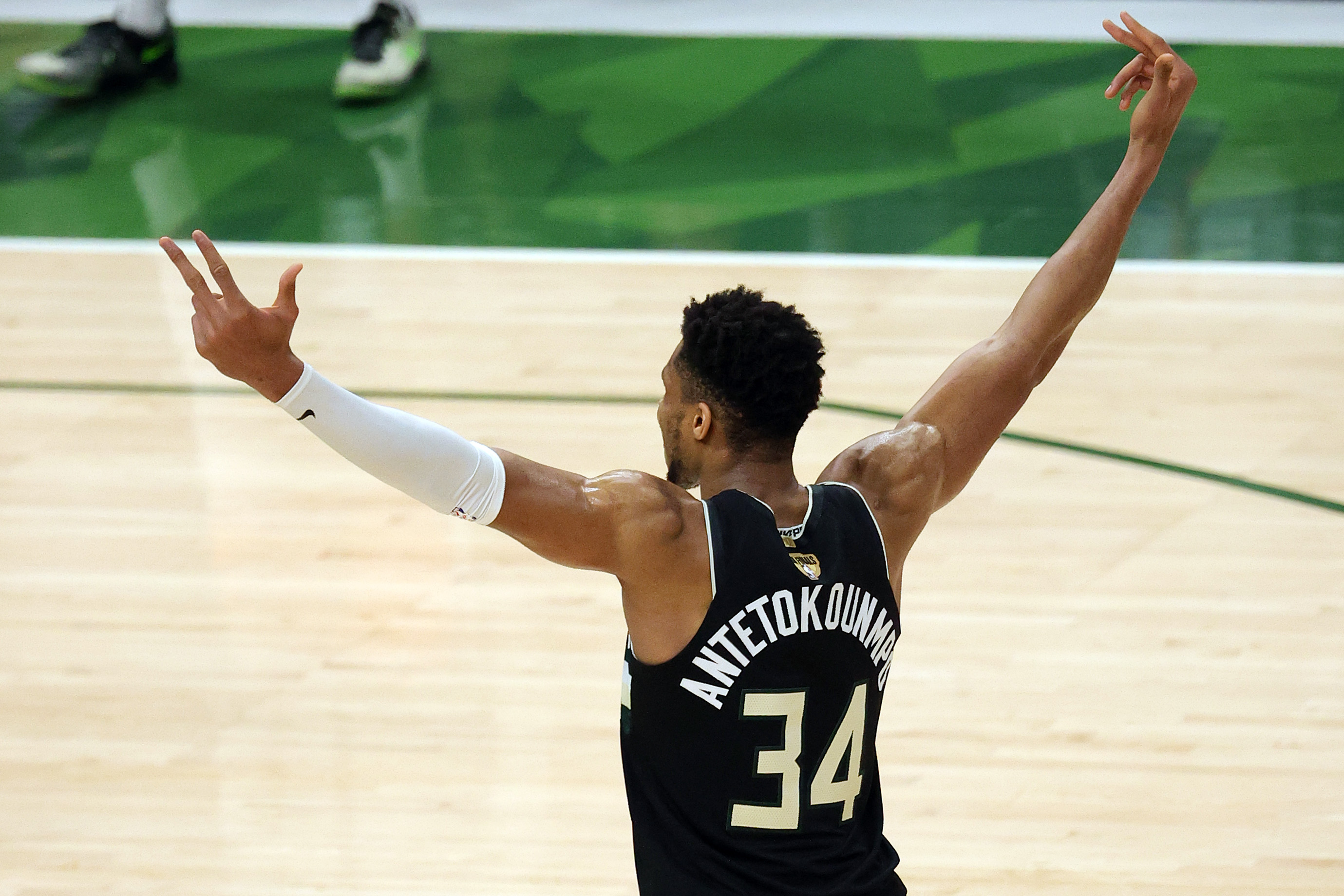 Bucks star Giannis Antetkounmpo celebrates in the final moments of Milwaukee's Game 6 victory over the Phoenix Suns in the 2021 NBA Finals